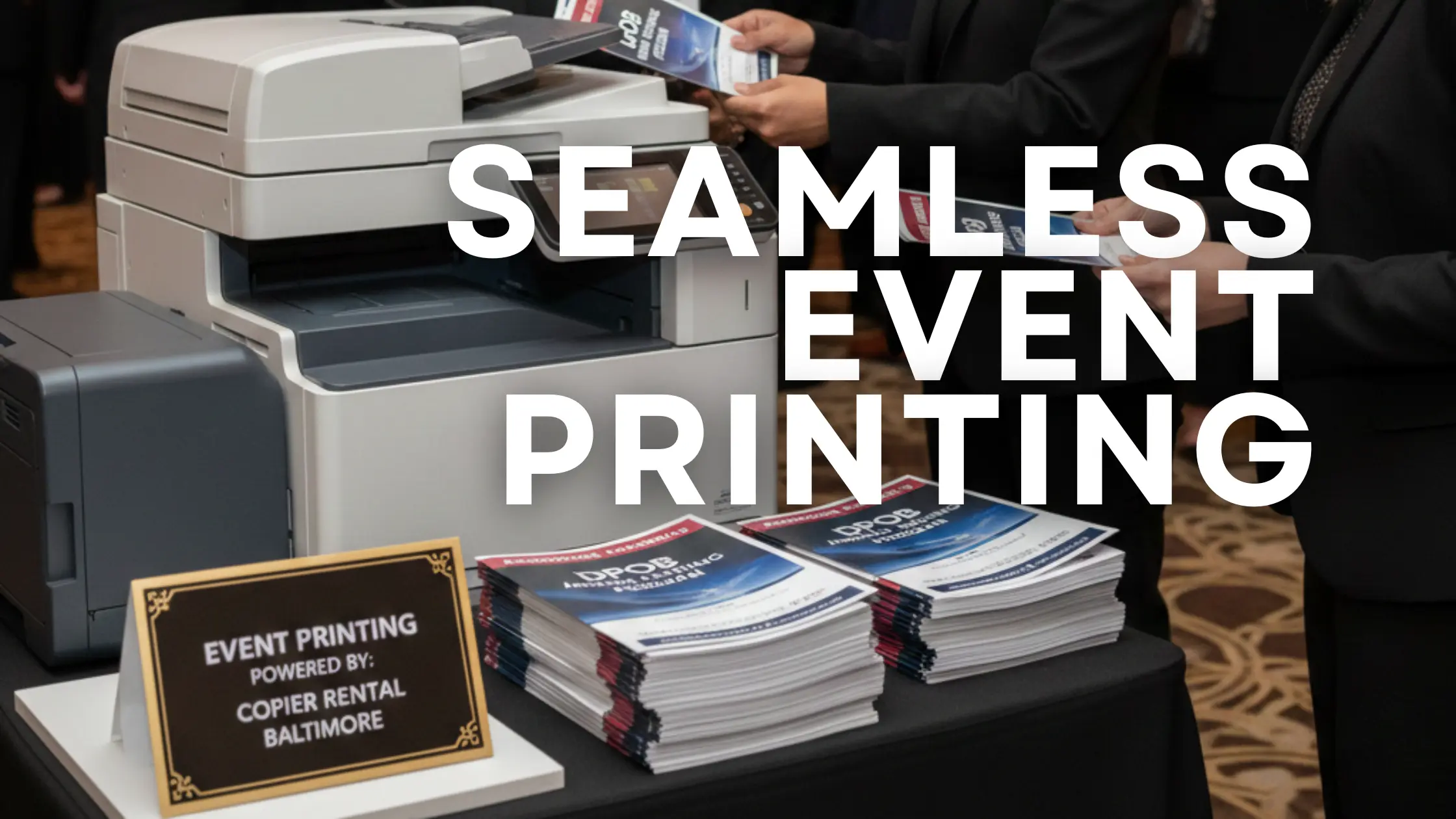 Event staff using a rented copier (branded Clear Choice Technical Services) to print materials at a large Baltimore event.